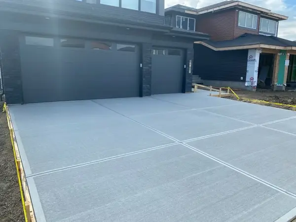 Completed residential driveway with broom finish