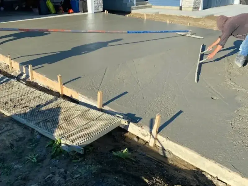 Jenstar Concrete crew finishing a residential driveway