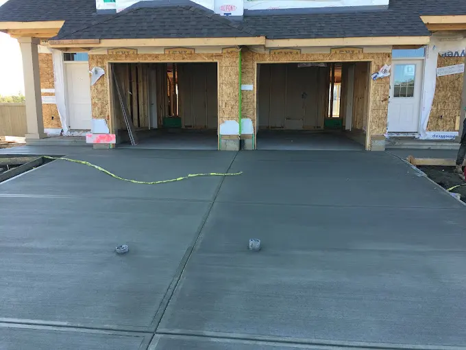 Triple garage driveway fresh pour
