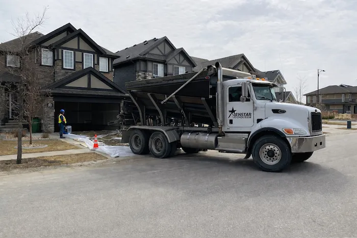 Jenstar Concrete truck on-site at a residential driveway pour